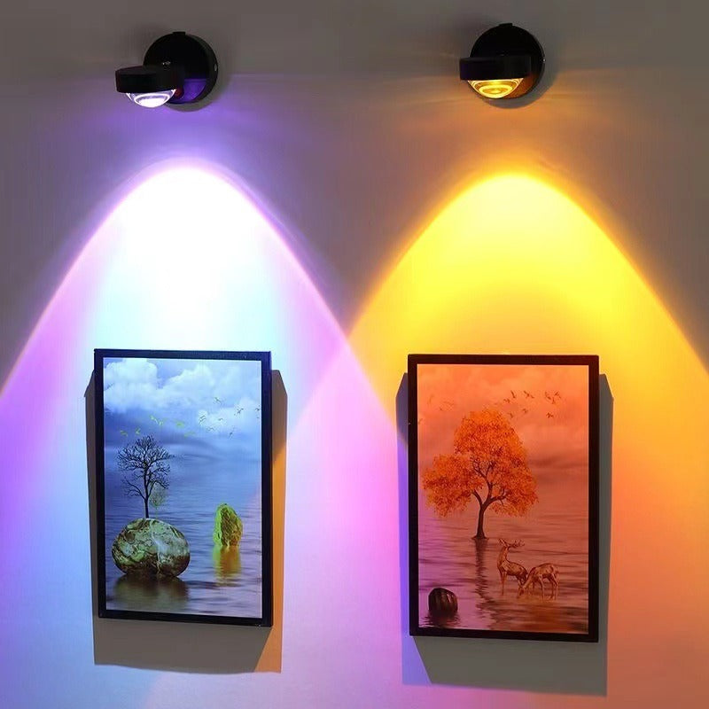Deux appliques coucher de soleil éclairant un cadre au mur