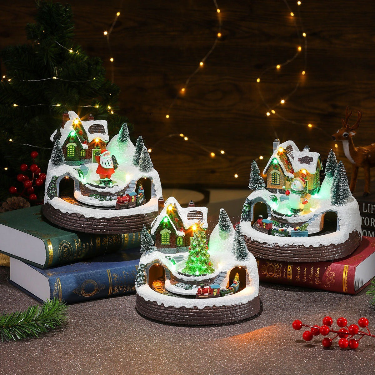 Trois boîtes à musique village de Noël illuminées