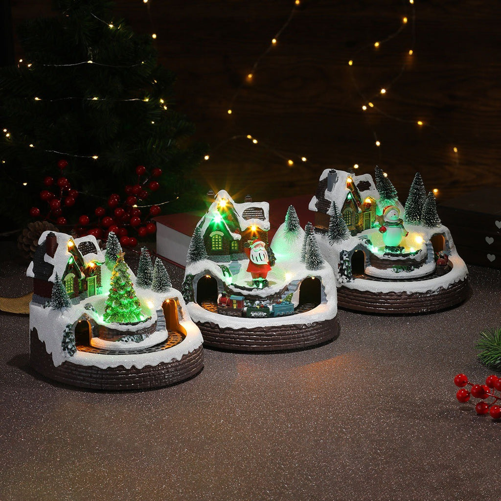 Villages de Noël musicaux allumés dans la pénombre