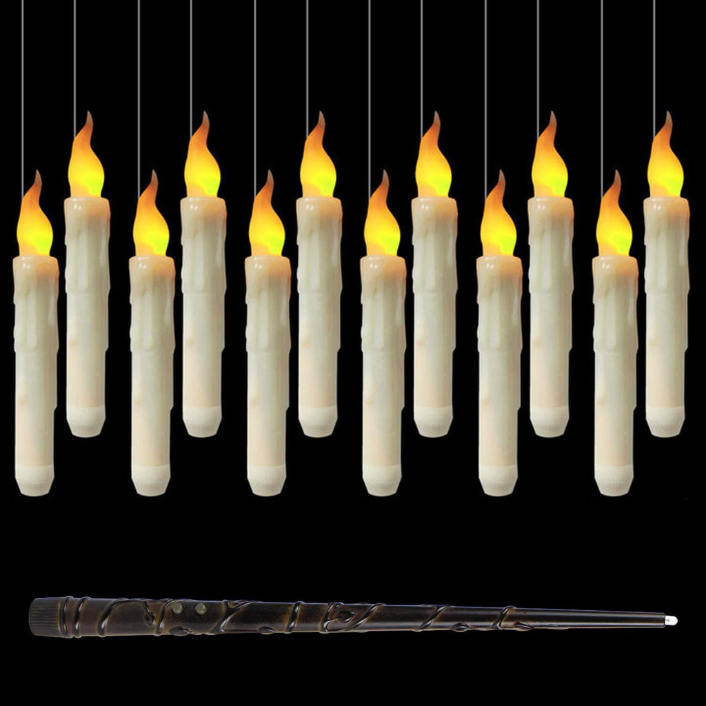 Douze bougies flottantes LED allumées et leur baguette magique