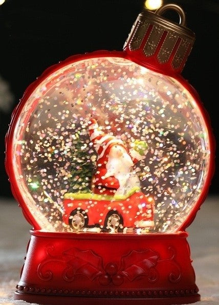 Boule à neige lumineuse Père Noël en voiture, socle rouge