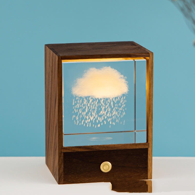 Cube de cristal gravé d’un nuage lumineux