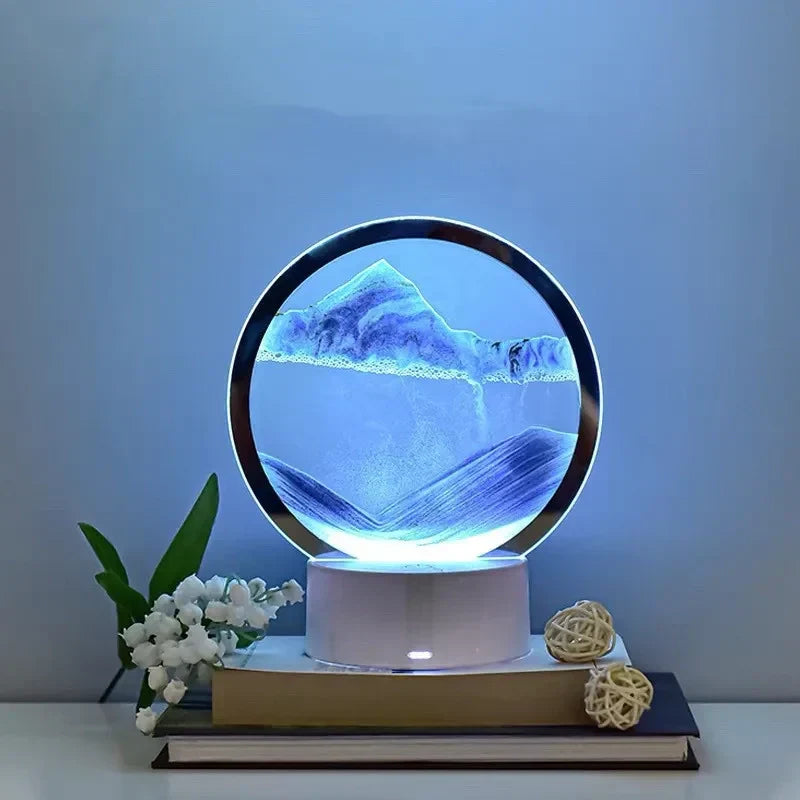 Lampe sable mouvant posée sur des livres