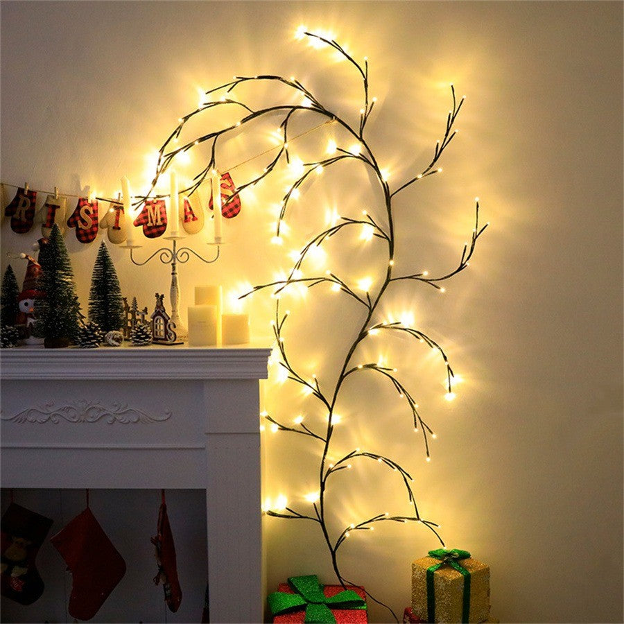 Branche de saule lumineuse encadrant une cheminée