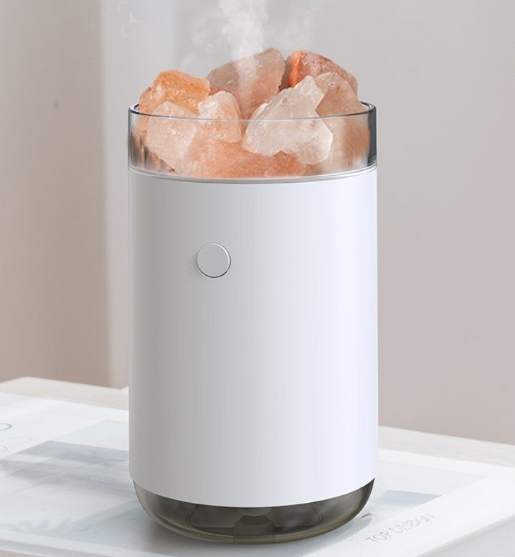 Humidificateur surmonté de pierres de sel rose, brume légère