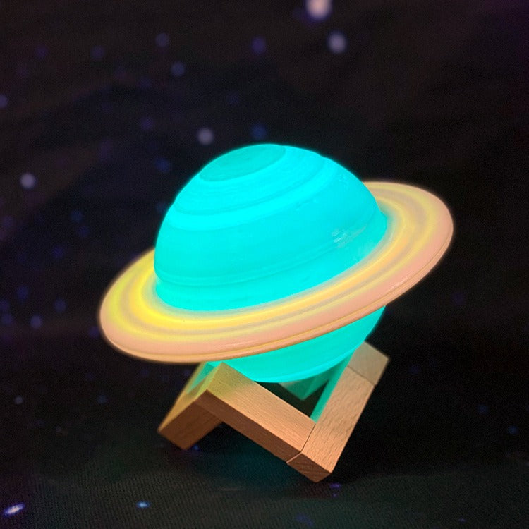 Lampe Saturne éclairée en turquoise