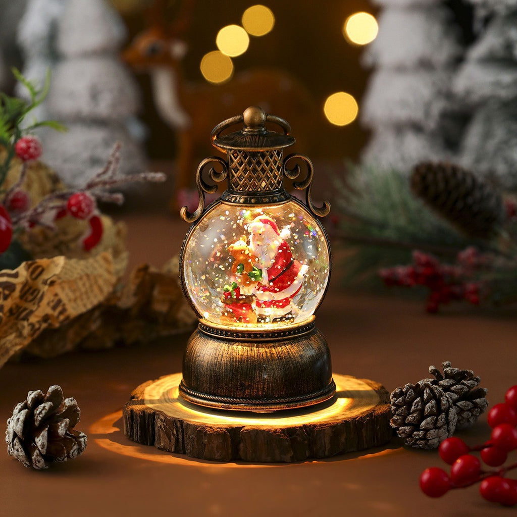 Lanterne boule à neige lumineuse avec Père Noël et son ourson, socle bronze