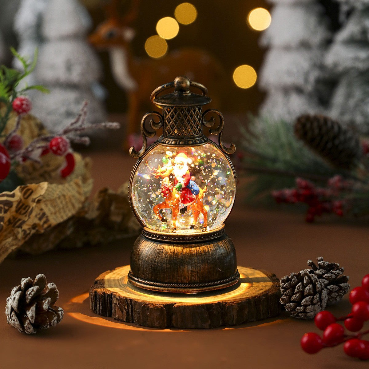 Boule à neige lumineuse Père Noël et son renne