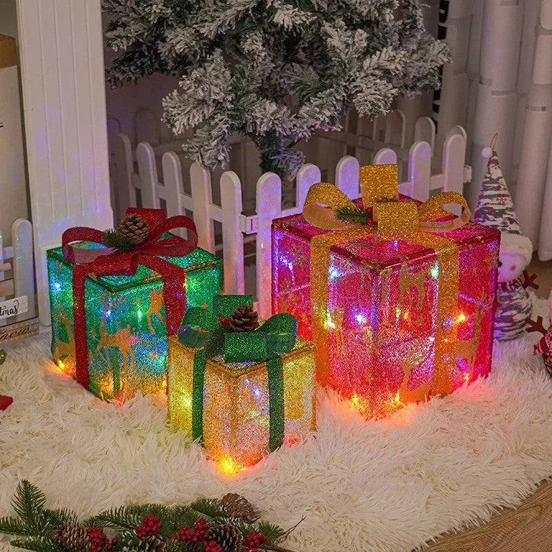Paquets cadeaux lumineux en mode multicolore sous un sapin