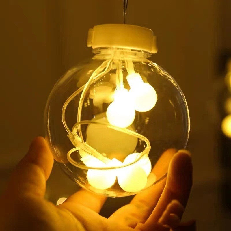 Bulle lumineuse blanc chaud tenue dans la main
