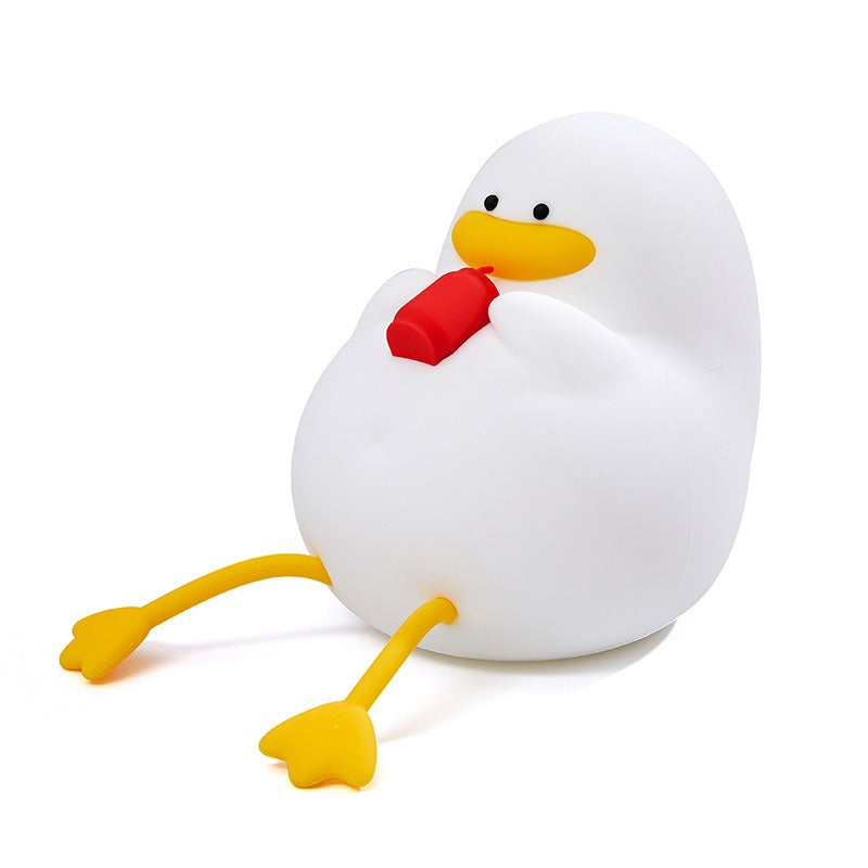 Veilleuse canard au chapeau éteinte, jambes pendantes
