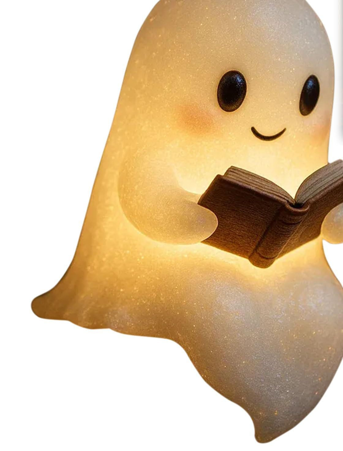 Petit fantôme lumineux tenant un livre ouvert