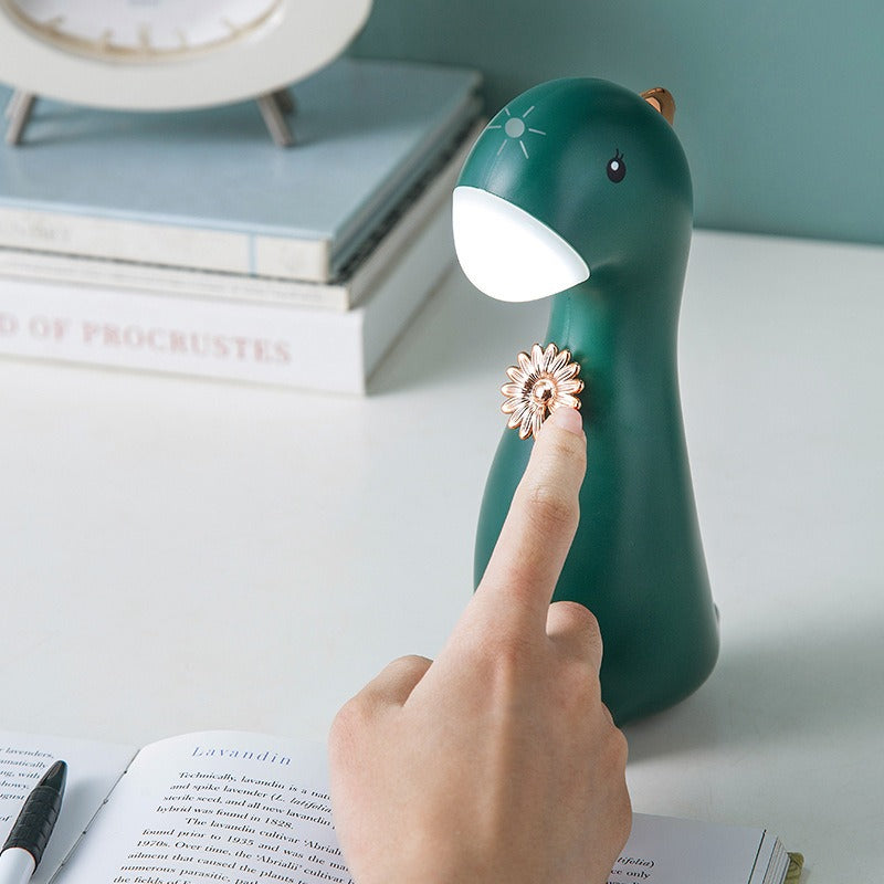 Veilleuse dinosaure vert sapin allumée d’une simple touche