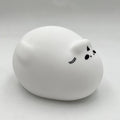 Veilleuse phoque en silicone blanc, allongé