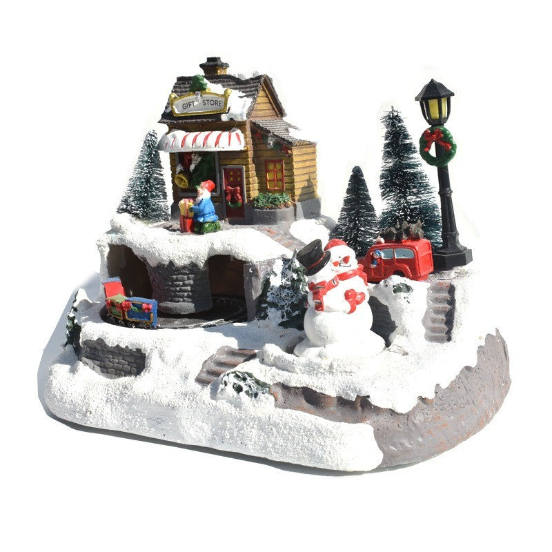 Village de Noël animé avec bonhomme de neige et lampadaire