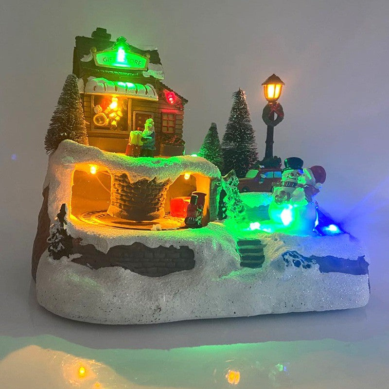 Village de Noël musical illuminé de lumières colorées